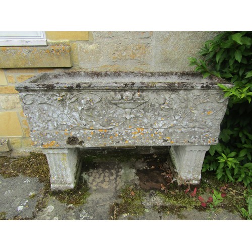 1016 - A weathered carved composition stone planter of rectangular form with moulded detail in the Adam sty... 