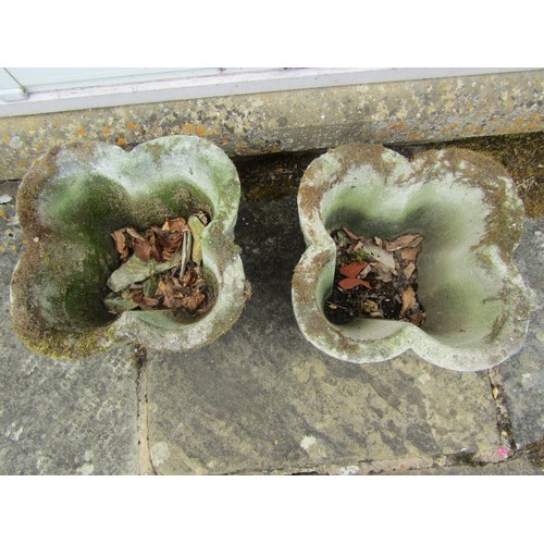 1017 - A pair of weathered composition stone quatrefoil form planters with stepped detail, 26cm high, 39cm ... 