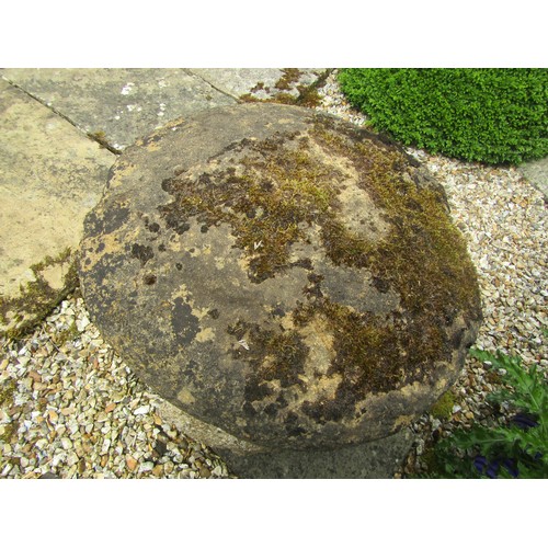 1019 - A low weathered natural stone staddle stone and cap, 56cm high, 67cm cap diameter approximately

Fro... 