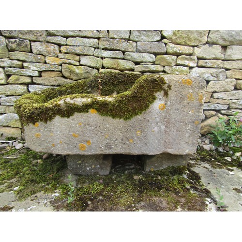 1024 - A weathered lychen covered natural stone planter / trough of rounded rectangular form (with consider... 