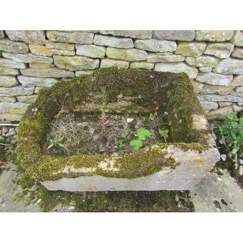 1024 - A weathered lychen covered natural stone planter / trough of rounded rectangular form (with consider... 