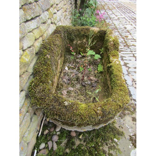 1024 - A weathered lychen covered natural stone planter / trough of rounded rectangular form (with consider... 