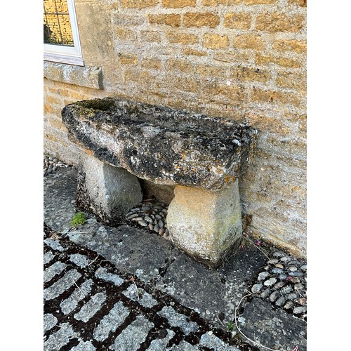 1025 - A weathered and gnarled natural stone planter / trough of rectangular form raised on an associated p... 