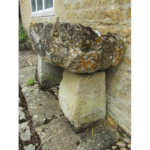 1025 - A weathered and gnarled natural stone planter / trough of rectangular form raised on an associated p... 