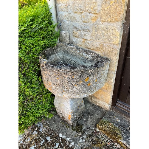 1027 - A small Demi-lune weathered natural stone planter / trough raised on tall associated staddle support... 