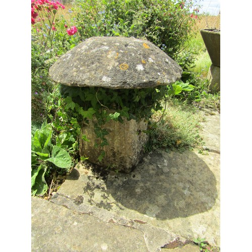 1033 - A weathered natural stone staddle stone and cap, ivy covered, 66cm high, 60cm diameter (2)

From the... 