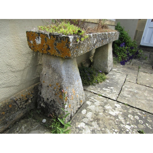 1035 - A weathered natural stone planter / trough of rectangular form, of shallow proportions, raised on an... 