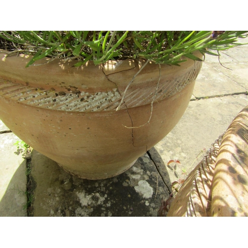 1039 - pair of weathered terracotta planters of tapering form with fluted collars, (one severely damaged) e... 