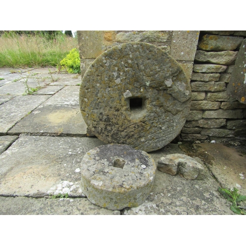 1044 - Two old weathered millstones, 57cm and 30cm diameter (2) 

From the collection of a private North Co... 