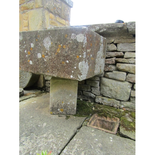 1045 - A weathered natural stone planter / trough of square form raised on associated plinth support, 28cm ... 