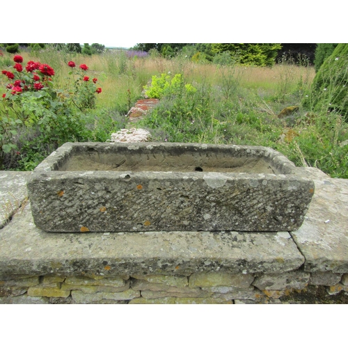 1046 - A small weathered stone planter / trough of rectangular form, 21cm high, 93 x 35cm.

From the collec... 