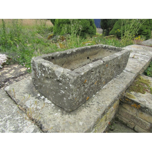 1046 - A small weathered stone planter / trough of rectangular form, 21cm high, 93 x 35cm.

From the collec... 