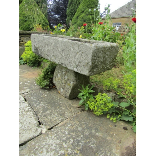 1050 - A weathered natural stone two-sectional stone planter raised on associated rough hewn stone base, 21... 