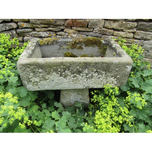 1055 - A neat weathered natural stone planter / trough of rectangular form raised on an associated staddle ... 