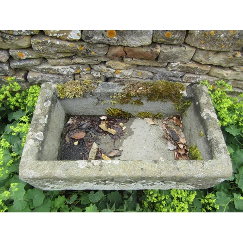 1055 - A neat weathered natural stone planter / trough of rectangular form raised on an associated staddle ... 