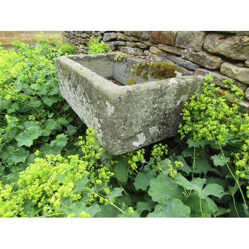 1055 - A neat weathered natural stone planter / trough of rectangular form raised on an associated staddle ... 