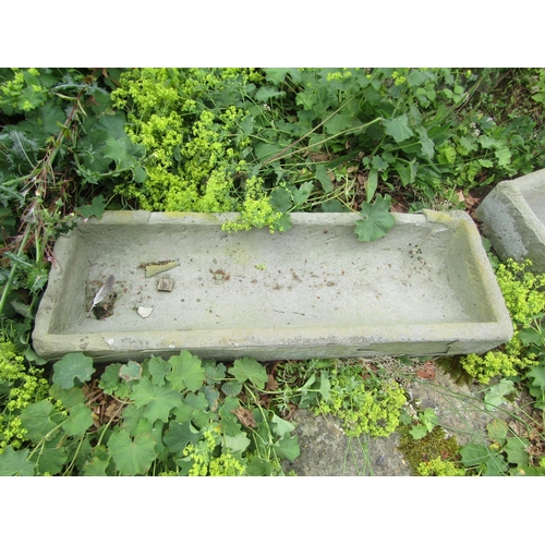 1056 - An associated pair of weathered natural stone planters / troughs of rectangular form (one with some ... 