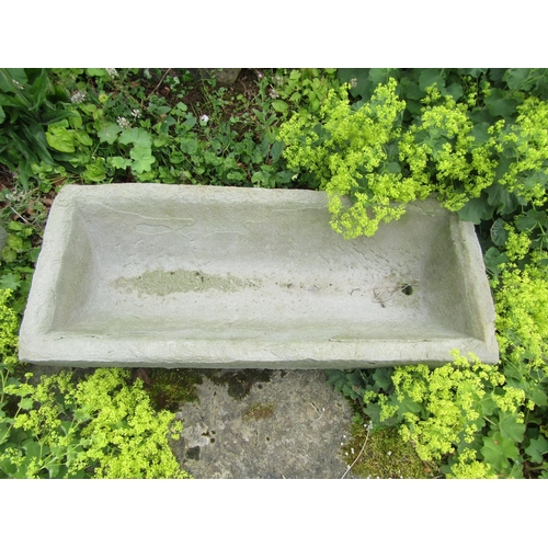 1056 - An associated pair of weathered natural stone planters / troughs of rectangular form (one with some ... 