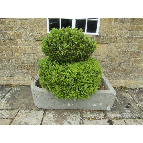 1057 - A large weathered natural stone planter / trough of rectangular form with a rounded edge (with well ... 