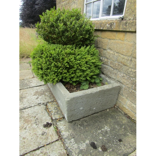 1057 - A large weathered natural stone planter / trough of rectangular form with a rounded edge (with well ... 