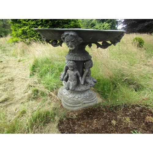 1059 - An impressive bronzed lead effect cast metal free-standing fountain, with seated putti and mask deta... 