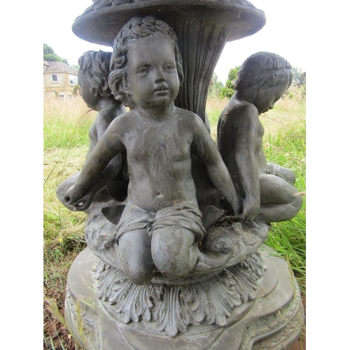 1059 - An impressive bronzed lead effect cast metal free-standing fountain, with seated putti and mask deta... 