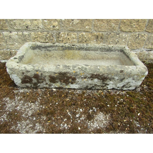 1062 - A weathered natural stone planter / trough of bowed rectangular form, 20cm high, 90 x 40cm together ... 