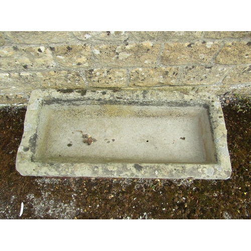 1062 - A weathered natural stone planter / trough of bowed rectangular form, 20cm high, 90 x 40cm together ... 