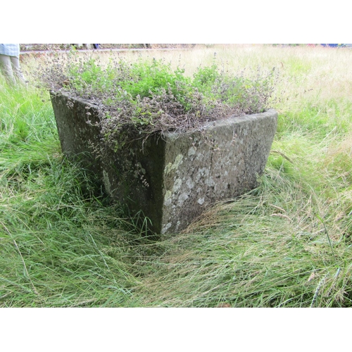 1074 - A large weathered natural stone planter / trough of demi-lune form (located in main lawn) 57cm high,... 