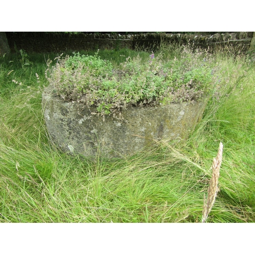 1074 - A large weathered natural stone planter / trough of demi-lune form (located in main lawn) 57cm high,... 