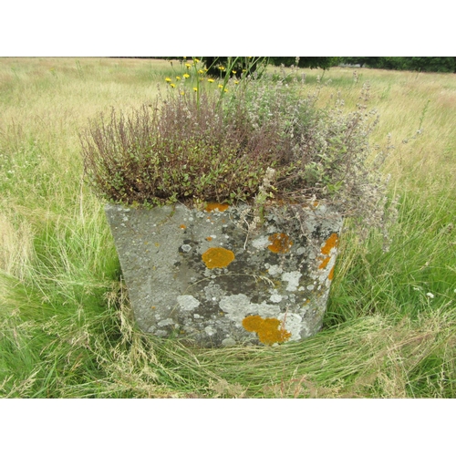 1075 - A weathered natural stone planter / trough of canted rectangular form, 69cm high, 136 x 78cm.

From ... 