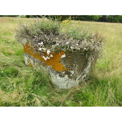 1075 - A weathered natural stone planter / trough of canted rectangular form, 69cm high, 136 x 78cm.

From ... 