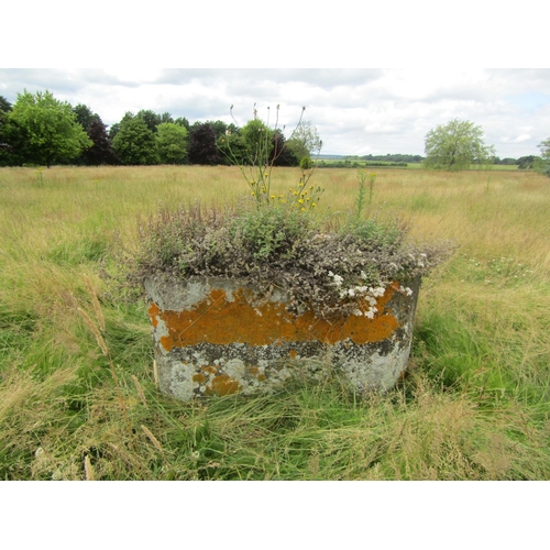 1075 - A weathered natural stone planter / trough of canted rectangular form, 69cm high, 136 x 78cm.

From ... 