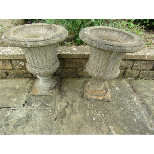 1078 - A pair of weathered composition stone campagna urn garden planters (2) (AF) 50cm high, 38cm diameter... 