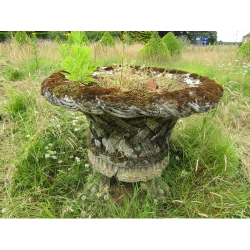 1082 - A well weathered composition stone garden planter of tapering cylindrical form, with flared rim and ... 