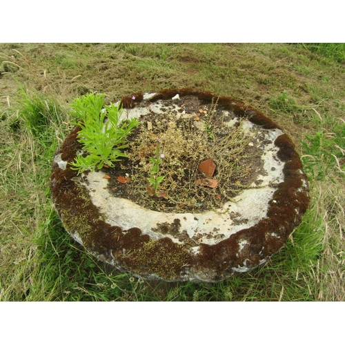 1082 - A well weathered composition stone garden planter of tapering cylindrical form, with flared rim and ... 