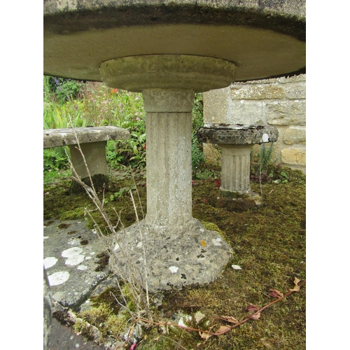 1083 - A five-piece composition stone garden / patio set composting table (86cm high, 90cm diameter) pair o... 