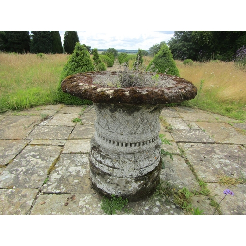 1089 - A well weathered composition stone garden planter of tapering cylindrical form, with flared rim and ... 