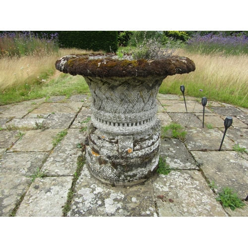 1089 - A well weathered composition stone garden planter of tapering cylindrical form, with flared rim and ... 