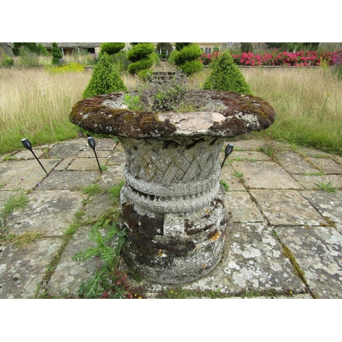 1089 - A well weathered composition stone garden planter of tapering cylindrical form, with flared rim and ... 