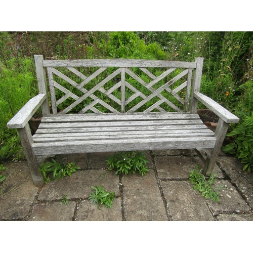 1092 - A weathered ‘Lister’ teak garden bench, 88cm high, 149cm wide.

From the collection of a private Nor... 