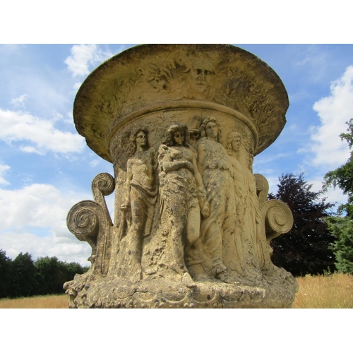 1097 - A monumental pair of 19th century weathered composition stone garden urns, raised on associated plin... 