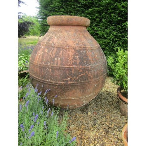 1101 - A very large combed weathered terracotta olive jar / vessel, 120cm high, mouth diameter 48cm. 

From... 