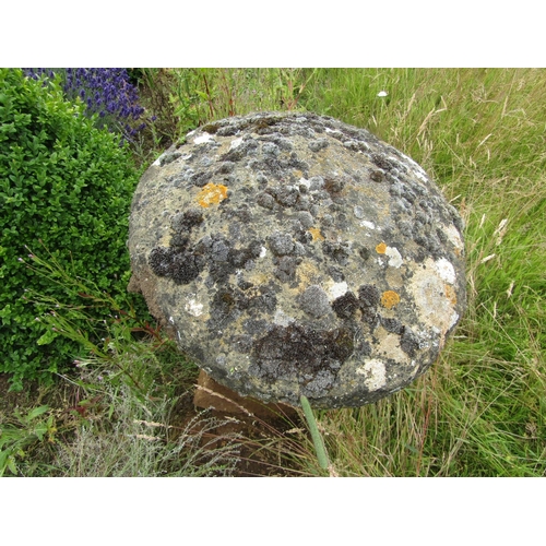 1121 - A weathered natural staddle stone and cap (2) 52 cm high, 50 cm cap diameter 

From the collection o... 