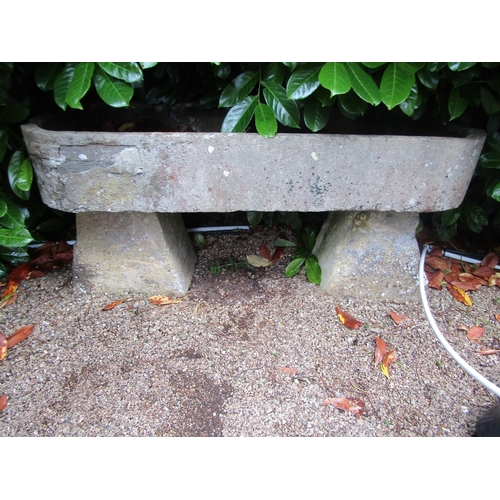 1128 - A large and impressive natural stone planter / trough of rounded rectangular form, raised on an asso... 