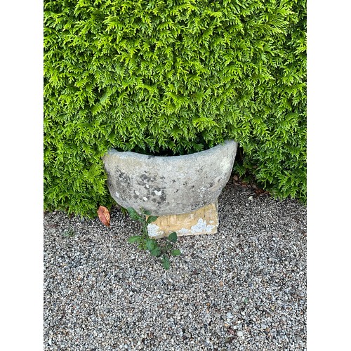 1005 - A weathered natural stone Demi-lune planter / trough raised on associated base (2)

From the collect... 