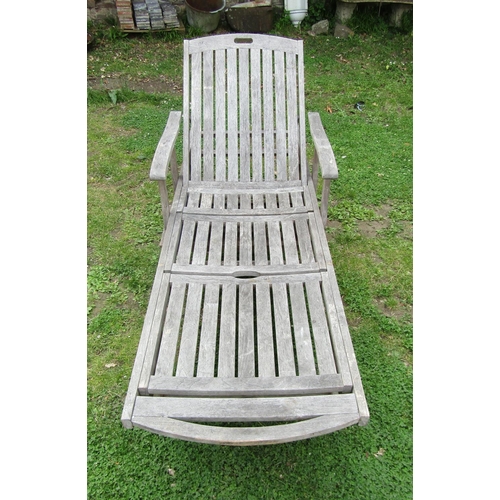 1178 - A Bramblecrest weathered (silvered) teak two wheeled garden sun lounger with adjustable slated seat ... 