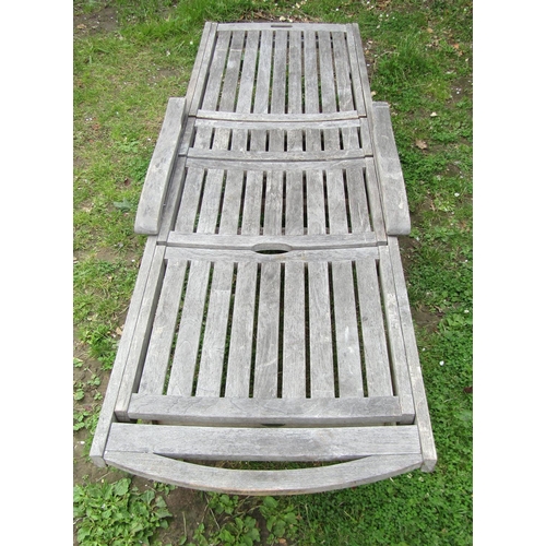 1178 - A Bramblecrest weathered (silvered) teak two wheeled garden sun lounger with adjustable slated seat ... 