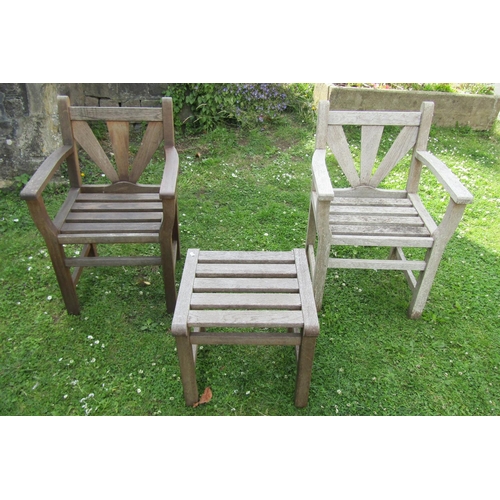 1179 - A pair of Gloster teak garden chairs with open arms and slatted detail together with a acompaning st... 