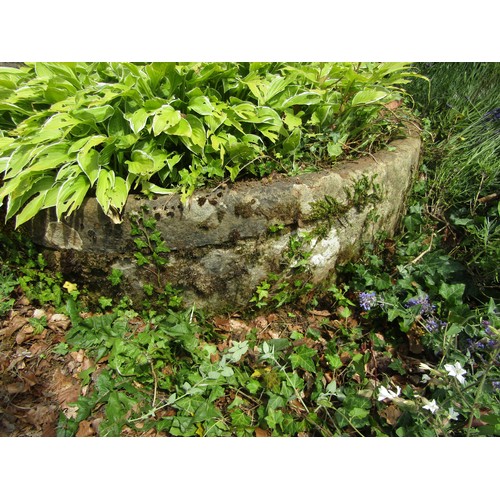 1129 - A very large and impressive Demi-lune form natural stone planter, 32cm high, 140 x 96cm.

From the c... 